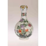 A SMALL CHINESE FAMILLE ROSE BOTTLE VASE, with garlic neck,