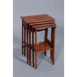 A SET OF FOUR EDWARDIAN STRING INLAID MAHOGANY NESTING TABLES, each with moulded rectangular top,