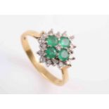 AN EMERALD AND DIAMOND RING,