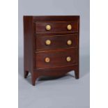 A 19TH CENTURY MAHOGANY MINIATURE CHEST OF DRAWERS, bow-fronted,