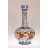 A CHINESE PORCELAIN BOTTLE VASE, enamel painted with two five-clawed dragons.