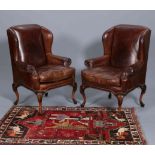 A GOOD PAIR OF BROWN LEATHER WING CHAIRS,