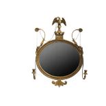 FRENCH EMPIRE GILT MIRROR - Period Oval Gilt Framed Looking Glass, early 19th c., having a carved