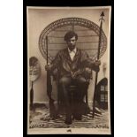 ORIGINAL 1960'S PROTEST POSTER - Huey Newton Seated in Wicker Chair Holding Weapons, with Black