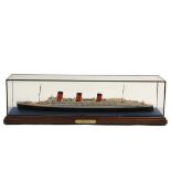 SMALL CASED SHIP MODEL - "Queen Mary", 1:600 scale, R. Hughes. In mahogany based brass trimmed case.