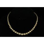 NECKLACE - 18K Yellow Gold Vintage Strand of Graduated Beads with Florentine Finish. 29.9 dwt; 17"