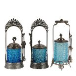 (3) VICTORIAN SILVER PLATE PICKLE CASTORS - Singles with cut snowflake ice blue glass jars, fancy