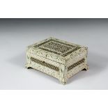 ANGLO-INDIAN KEEPSAKE BOX - Circa 1870 Hinged and Footed Oblong Box with reticulated veneer over