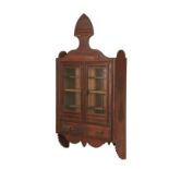 WALL CABINET - Eastlake Walnut Display Cabinet with flat spade form crest, two glass doors over four