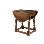 ENGLISH JOINT TABLE - Rare Form 18th c. Oak Drop Leaf Low Oval Table with top that twists for