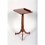 Regency rosewood writing table, tilt top with a reeded spiral pedestal supported on three reeded
