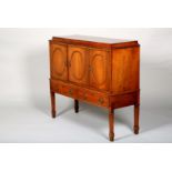 20th Century rosewood sideboard, three panel cabinet doors over twin fitted drawers raised on square