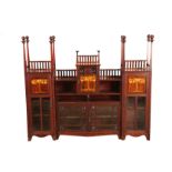 Arts and crafts mahogany bookcase, galleried top with upturned square tapered columns with spherical