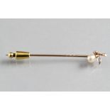 Gold stick pin with two mounted diamonds and a freshwater pearl