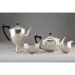 Late Victorian silver four piece tea service, oval shaped, part fluted, assay marked London 1900,