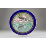 Royal Worcester charger, hand painted with a peacock standing by a pond, monogrammed by Jarman, date