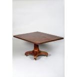 Early Victorian tip up mahogany breakfast table, rectangular top on a faceted pedestal, fixed to a