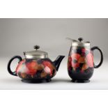 Moorcroft pottery four piece tea service, with pewter covers and mounts decorated with the