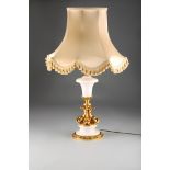 Gilt metal and white marble table lamp and shade, the column in the form of four dolphins