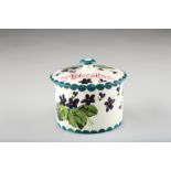 Wemyss pottery biscuit barrel and cover, decorated with hand painted violets, signed in green to