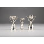 Three assorted Continental silver wedding cups in the form of figures holding swivel cups 8cm, 7.