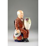 Limited Edition ceramic figure of William Moorcroft holding a vase by Kevin Francis Ceramics,