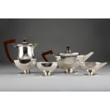 Art Deco 1930s four piece silver tea service, faceted form raised on rectangular feet with canted