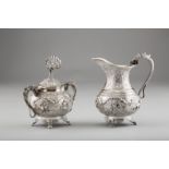 19th / 20th Century Burmese silver sugar basin and cover and a matching cream jug. Both decorated