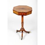Rosewood octagonal topped pedestal table with four fitted drawers on central turned pedestal on