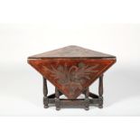 Oak drop leaf table, carved triangular top with a single triangular drop leaf, surface decorated