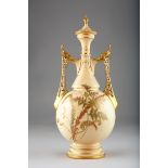 Royal Worcester vase and cover, with twin reticulated handles, blush ware decorated with ferns,