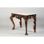 19th Century white marble topped console table, carved frieze and apron supported on deep floral