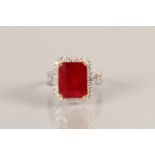 Ladies Ruby and Diamond Cluster Ring, approximately 10 carat emerald cut ruby