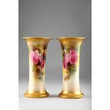 Pair of Royal Worcester vases, cylindrical form with flared rims, hand painted with mixed roses by