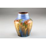 Royal Doulton Stoneware pottery vase, decorated in mottled blue, green, yellow and pink enamels