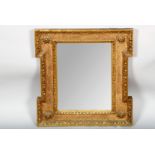 Gilt framed mirror with rose decoration to each corner, 64cm x 57cm