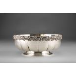 Tiffany & Co sterling silver bowl, fluted form with a scallop shell border raised on a circular