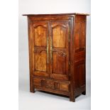 Louis XV chestnut armoire with overhanging moulded cornice over knot carved frieze with date 1867,