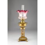 Victorian paraffin oil table lamp, heavy base with four corinthian columns with etched cranberry