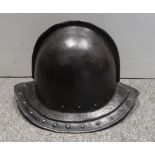 A PIKEMAN'S POT HELMET IN THE ENGLISH STYLE OF CIRCA 1630 with hemispherical crown formed in two