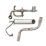 TWO WHEEL-LOCK SPANNERS AND A POWDER-MEASURE, 17TH CENTURY the first with curved barrel-shaped