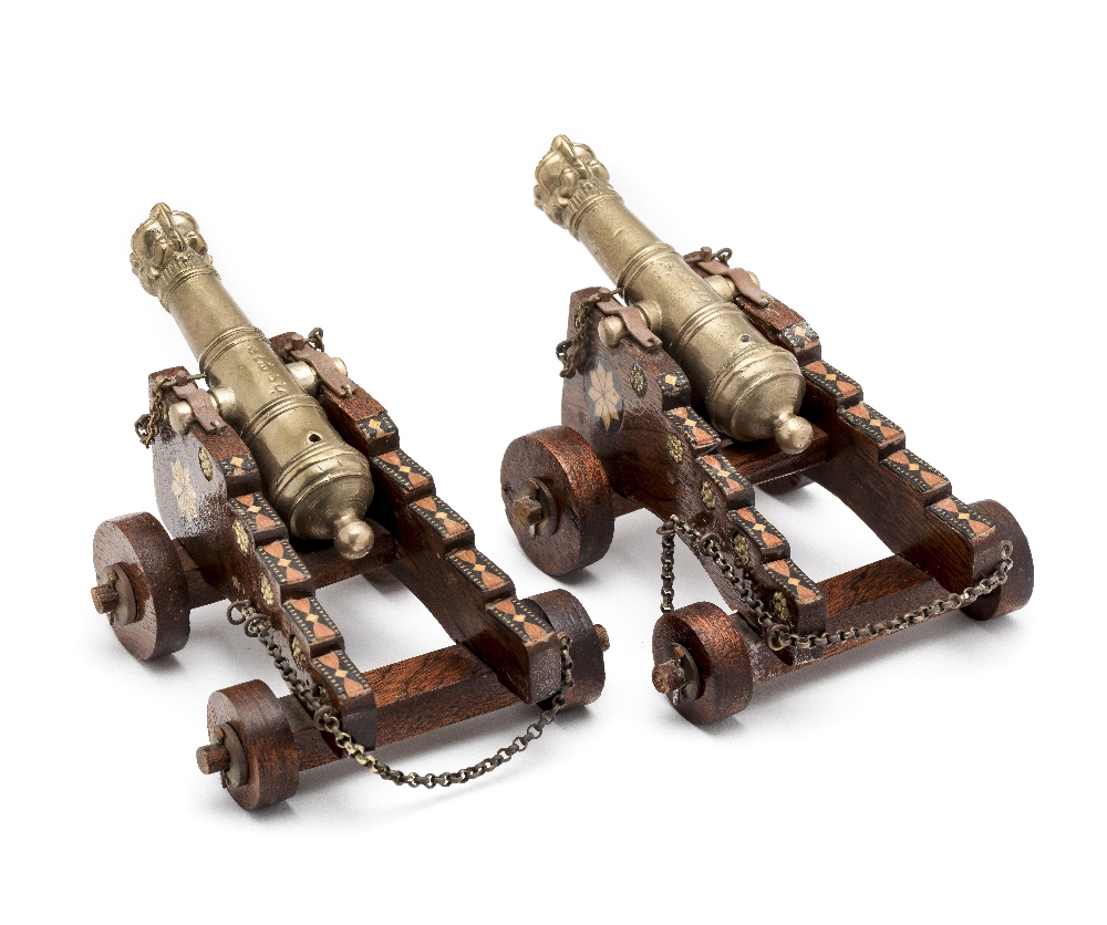 A RARE PAIR OF INDIAN MINIATURE CANNON, 18TH CENTURY each with tapering multi-stage barrel chiselled