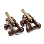 A RARE PAIR OF INDIAN MINIATURE CANNON, 18TH CENTURY each with tapering multi-stage barrel chiselled