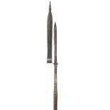 A SOUTHEAST ASIAN SPEAR, 19TH CENTURY with robust slender leaf-shaped head of diamond-section,