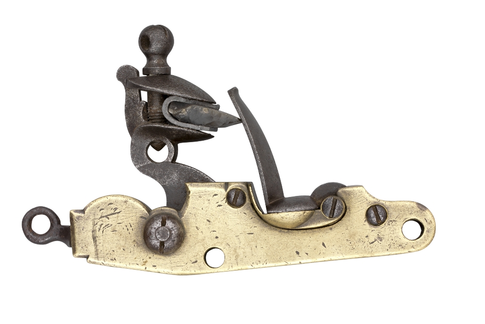 A DETACHED FLINTLOCK MECHANISM FOR A CANNON, EARLY 19TH CENTURY with brass body stamped with crowned