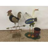 Metal Hen welcome sign together with a metal duck sign