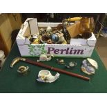 A box of Capo di Monte figure, walking stick, telephone, oil lamp,