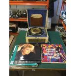 A Dansette 1950's table top record player and a small quantity of LP records