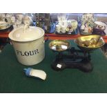 An enamel flour bin and scoop and a pair of kitchen scales with brass weights