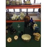 A tray of antique bottles, pestle and mortar, dog door stop, Wedgwood Sarah's garden vase,